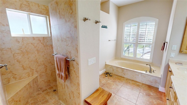 bathroom featuring tile patterned flooring, shower with separate bathtub, and vanity