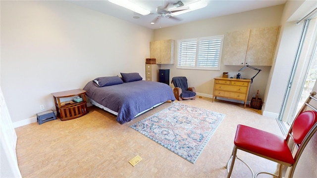 bedroom with ceiling fan and light hardwood / wood-style floors