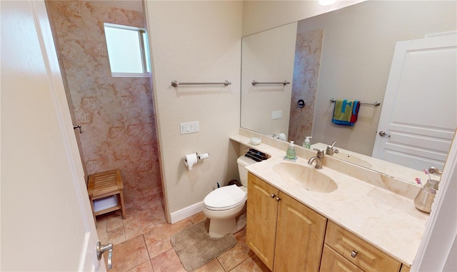 bathroom with vanity, toilet, and a shower