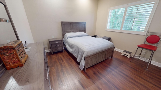 bedroom featuring dark wood-type flooring