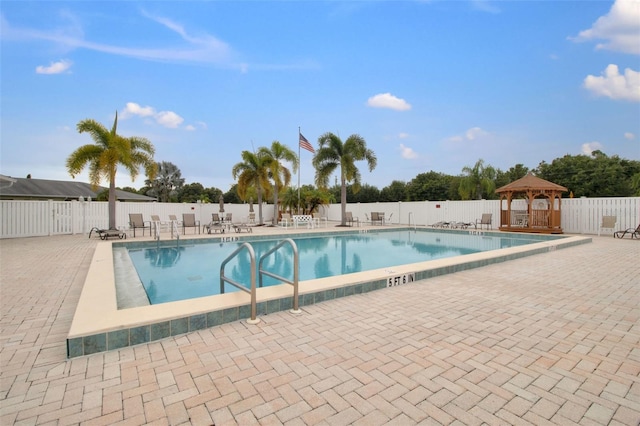 view of swimming pool with a gazebo and a patio area