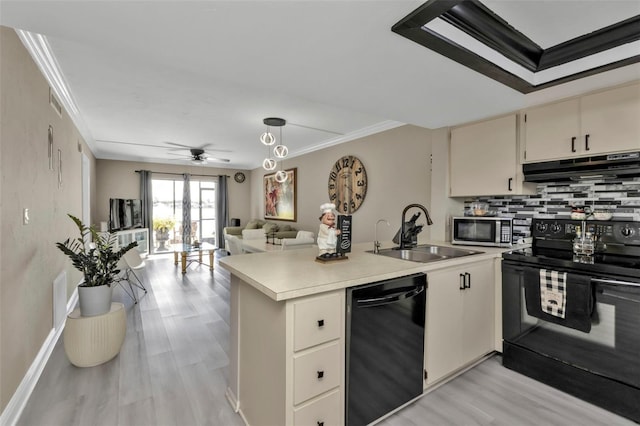 kitchen with black appliances, crown molding, sink, ceiling fan, and decorative light fixtures