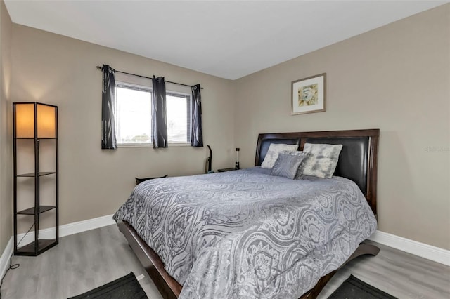 bedroom with wood-type flooring