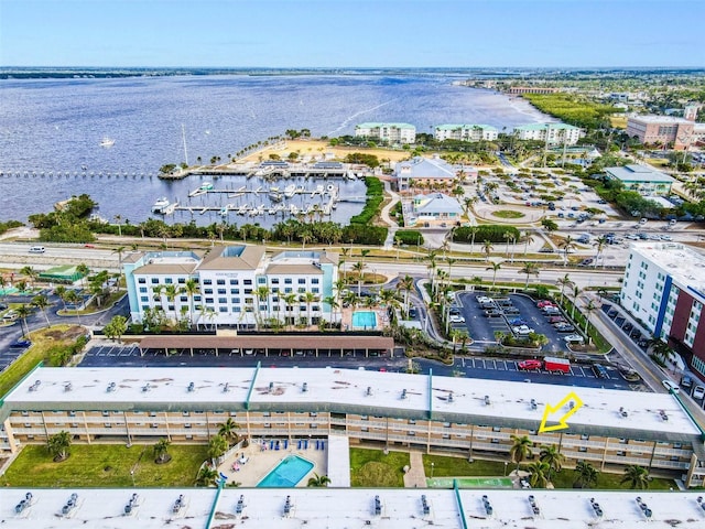 birds eye view of property with a water view