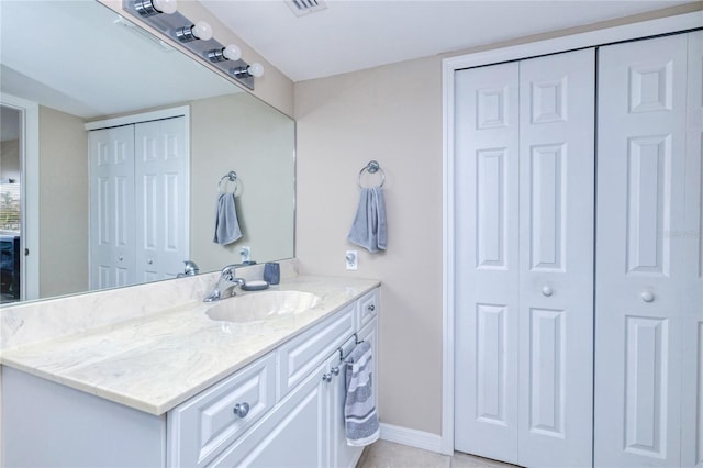 bathroom with vanity and tile patterned floors