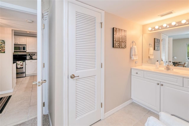 bathroom featuring tile patterned floors and vanity