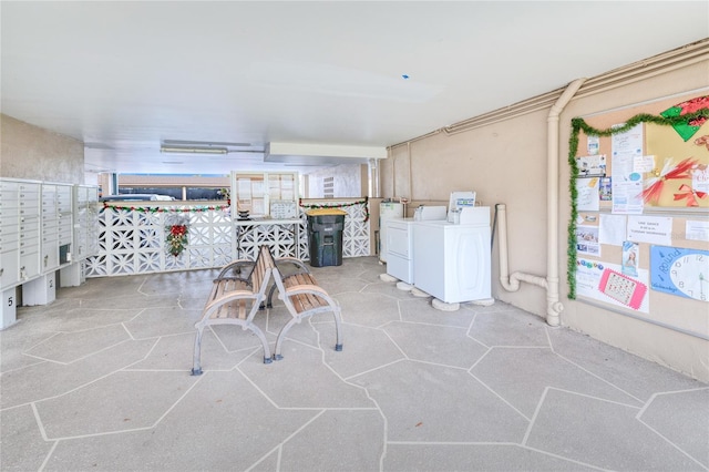 view of patio featuring washer and clothes dryer and a mail area