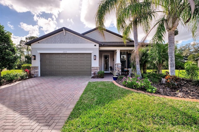 craftsman-style home with a front lawn and a garage