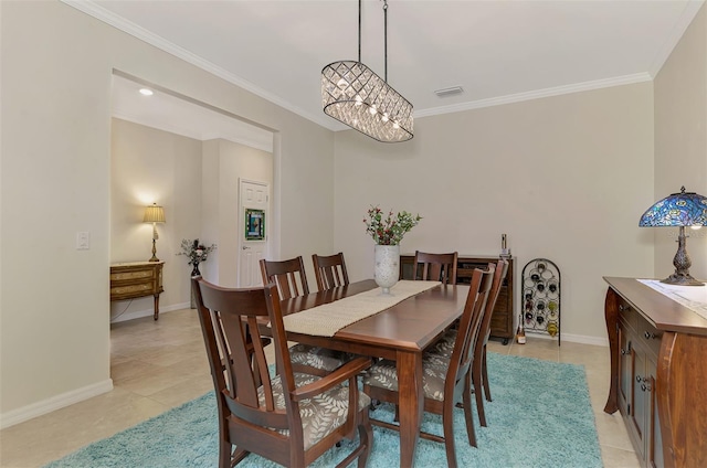 tiled dining space with crown molding and a notable chandelier