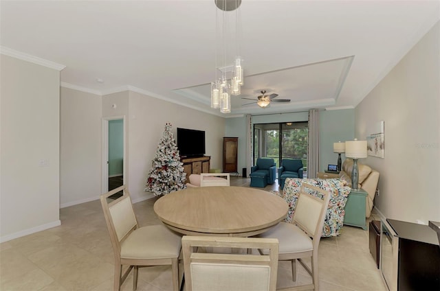 tiled dining room featuring ceiling fan and ornamental molding