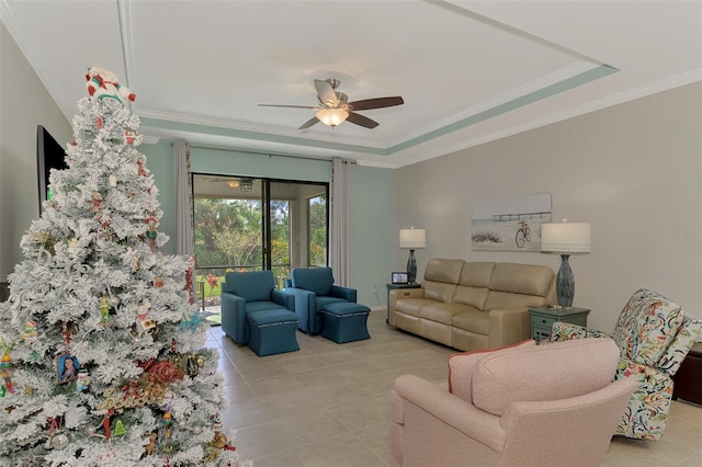 tiled living room featuring ceiling fan and crown molding