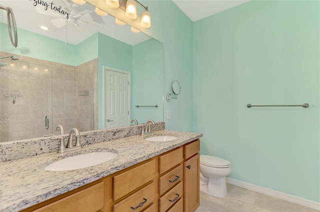 bathroom with tile patterned floors, walk in shower, vanity, ceiling fan, and toilet