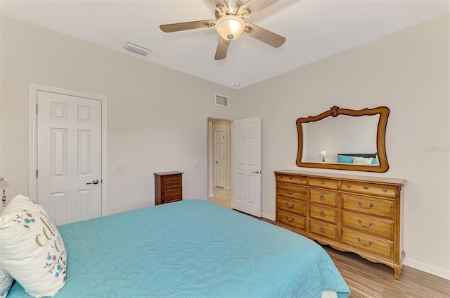 bedroom featuring ceiling fan and wood-type flooring