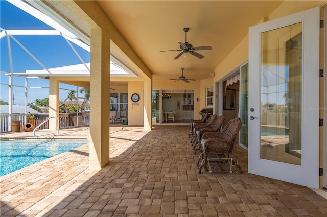 view of pool featuring a lanai, ceiling fan, and a patio area