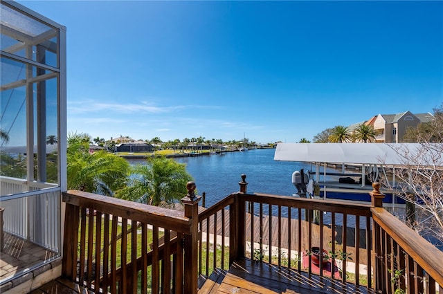 deck with a boat dock and a water view