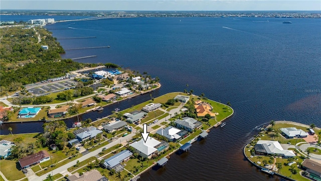 birds eye view of property with a water view