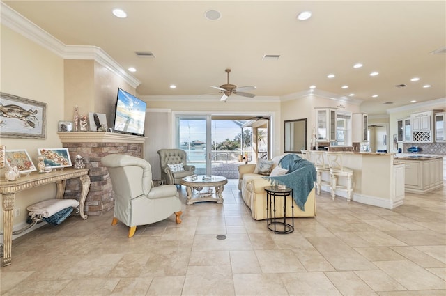 living room featuring light tile patterned floors, ornamental molding, and ceiling fan