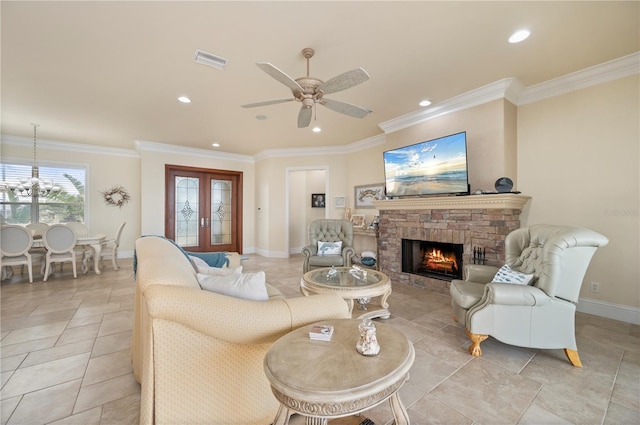 living room featuring crown molding, a fireplace, french doors, and ceiling fan with notable chandelier