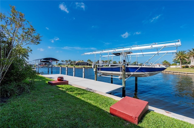 4431 Gardner Dr, Port Charlotte, FL 33952 - dock featuring boat lift, a water view, and a yard