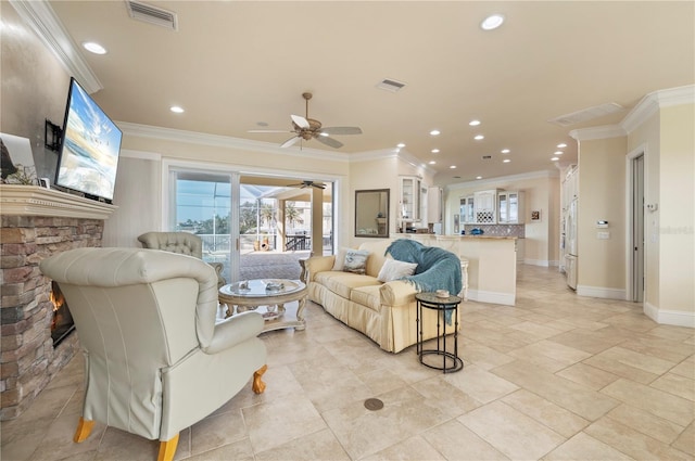 4431 Gardner Dr, Port Charlotte, FL 33952 - living room featuring a ceiling fan, ornamental molding, healthy amount of natural light, recessed lighting, and a stone fireplace