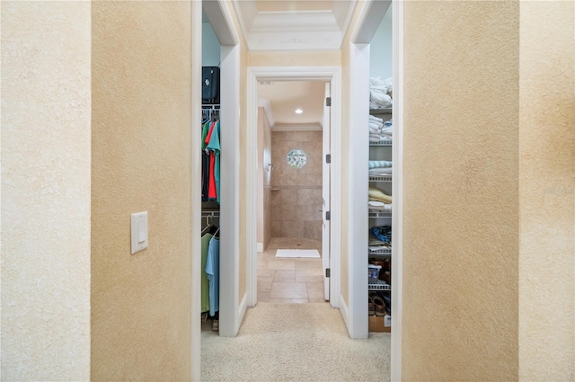 4431 Gardner Dr, Port Charlotte, FL 33952 - hallway featuring crown molding, a textured wall, and carpet