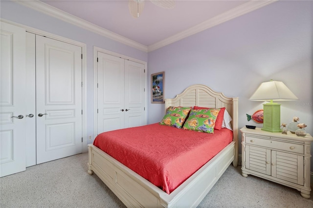 4431 Gardner Dr, Port Charlotte, FL 33952 - bedroom with two closets, crown molding, light colored carpet, and ceiling fan