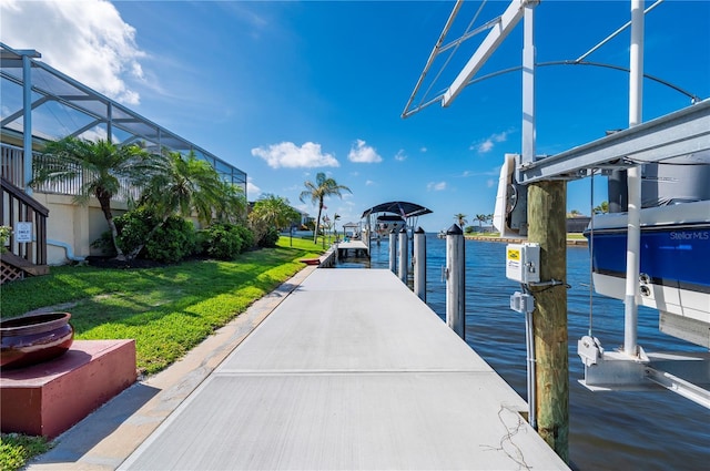 4431 Gardner Dr, Port Charlotte, FL 33952 - dock area with boat lift, a yard, and a water view