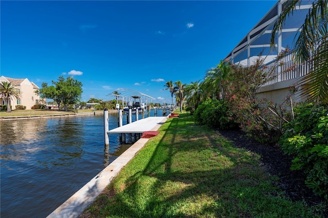 4431 Gardner Dr, Port Charlotte, FL 33952 - dock area with a water view and a lawn