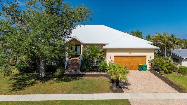 4431 Gardner Dr, Port Charlotte, FL 33952 - single story home with a garage, a front yard, decorative driveway, and stairway