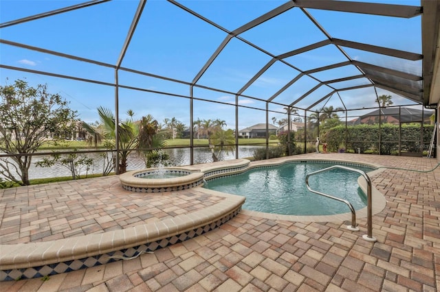 view of pool with glass enclosure, a patio area, a water view, and an in ground hot tub