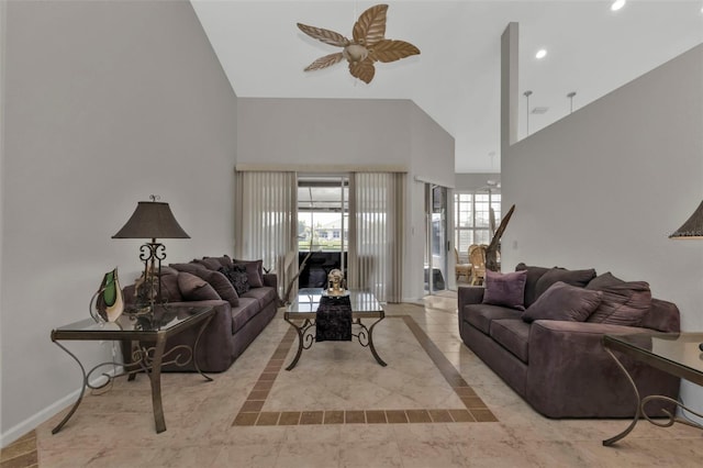 living room with ceiling fan and lofted ceiling