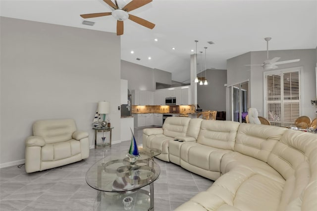 living room featuring light tile patterned floors, high vaulted ceiling, and ceiling fan