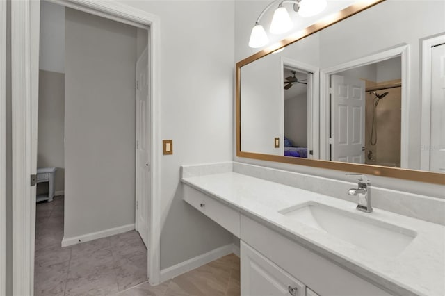 bathroom with tile patterned floors, ceiling fan, and vanity