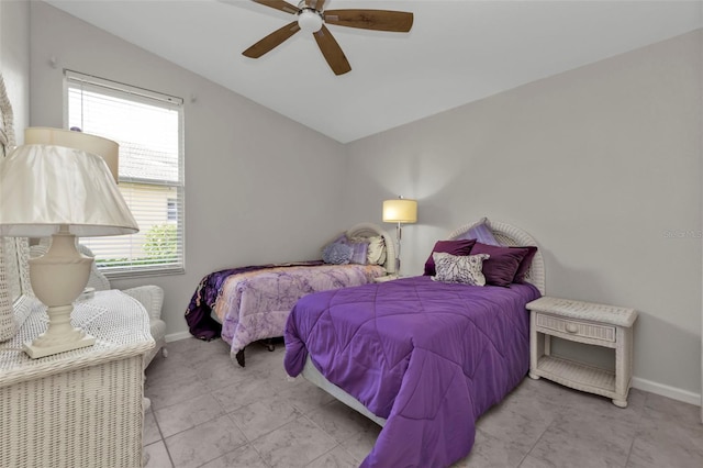 bedroom with ceiling fan and vaulted ceiling