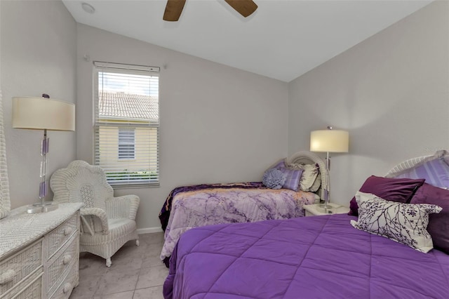 tiled bedroom with ceiling fan and vaulted ceiling