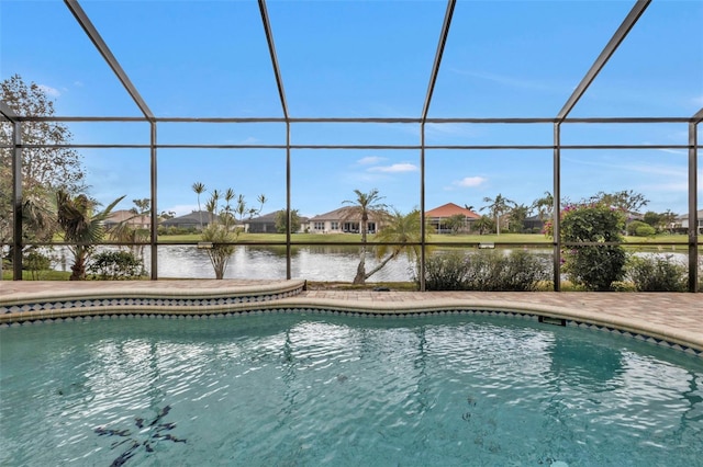 view of pool featuring a water view and glass enclosure