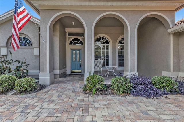 view of exterior entry featuring a porch