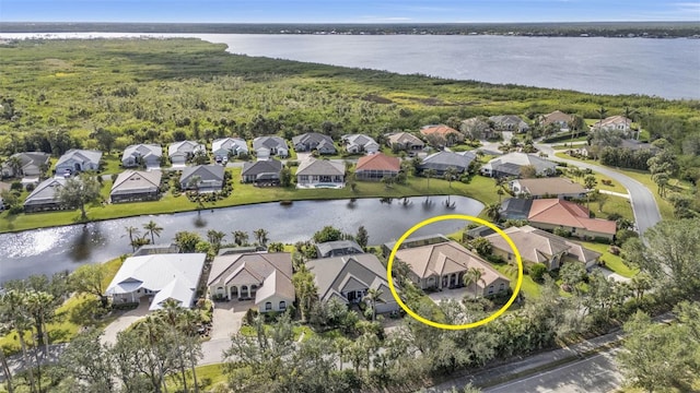 birds eye view of property featuring a water view