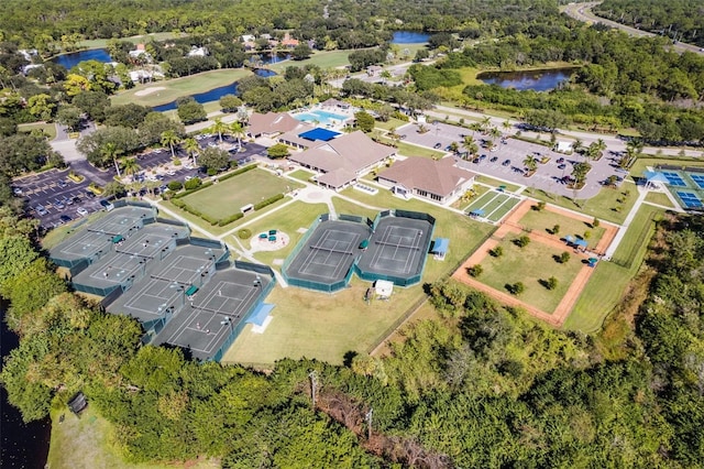 birds eye view of property with a water view