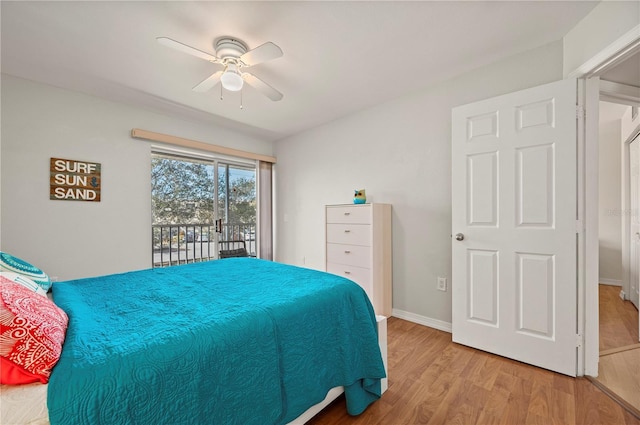 bedroom featuring hardwood / wood-style flooring, ceiling fan, and access to outside