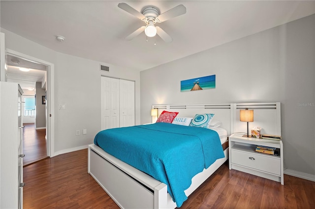 bedroom with ceiling fan, a closet, and dark hardwood / wood-style floors