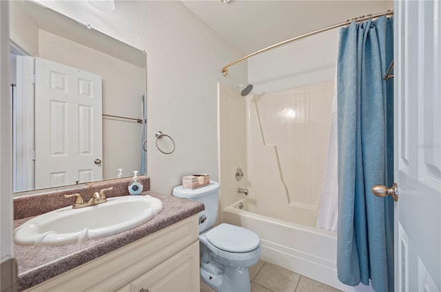 full bathroom featuring tile patterned floors, shower / bath combo with shower curtain, vanity, and toilet