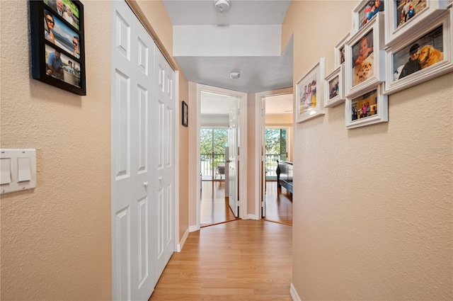 corridor featuring light wood-type flooring