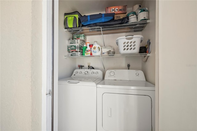 laundry area with separate washer and dryer