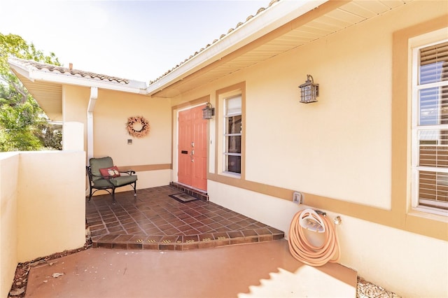 entrance to property with a patio area