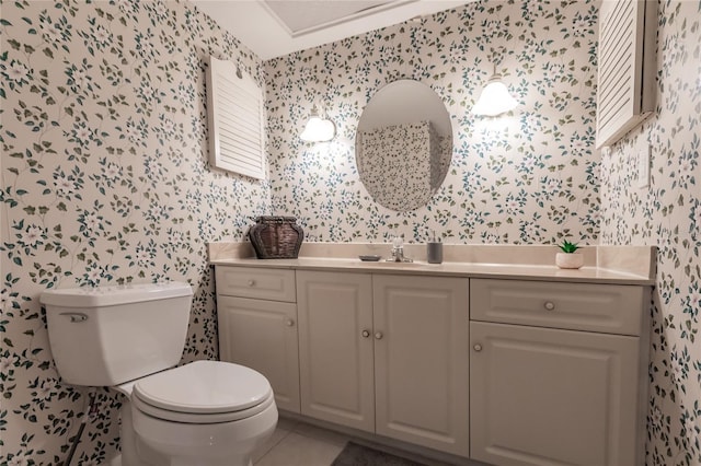 bathroom featuring tile patterned floors, vanity, and toilet