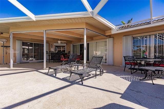 view of patio with a lanai and ceiling fan