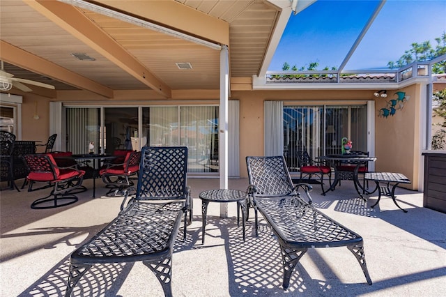 view of patio with ceiling fan