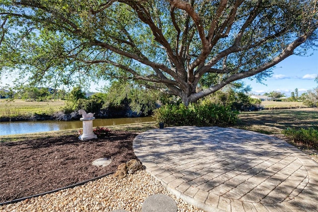 view of patio / terrace featuring a water view