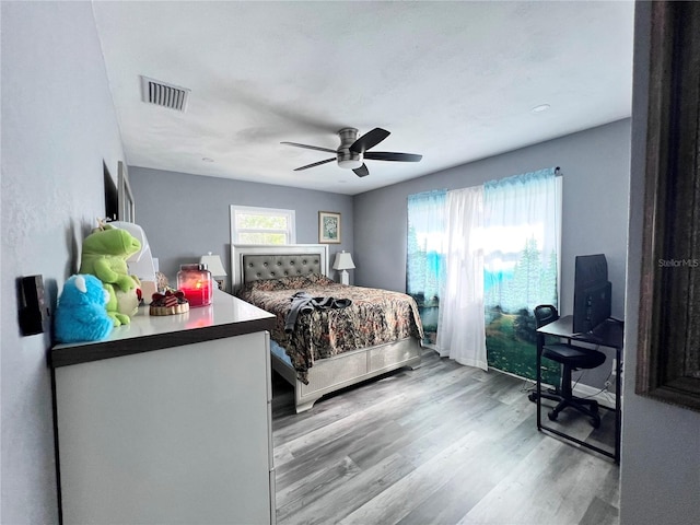 bedroom with light wood-type flooring and ceiling fan